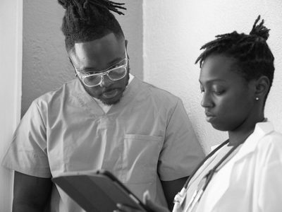 Clinician reviewing a chart on a tablet